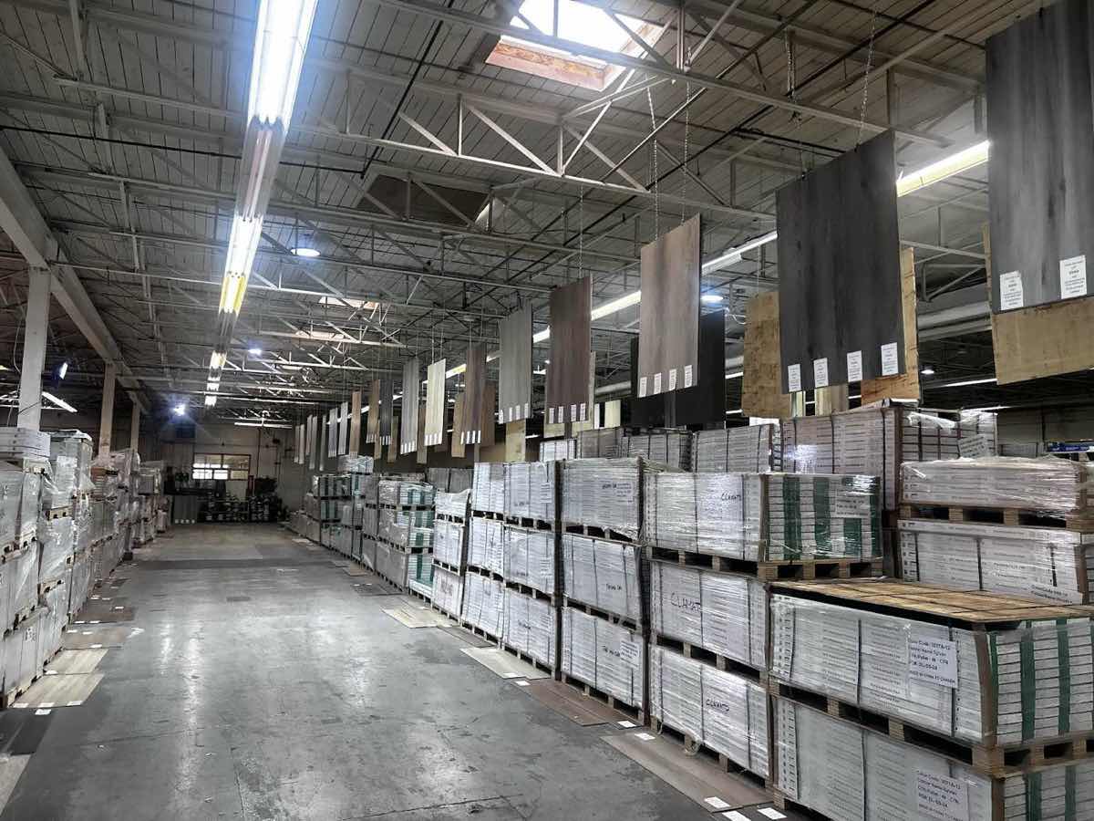 Calgary Liquidator warehouse interior with massive flooring inventory